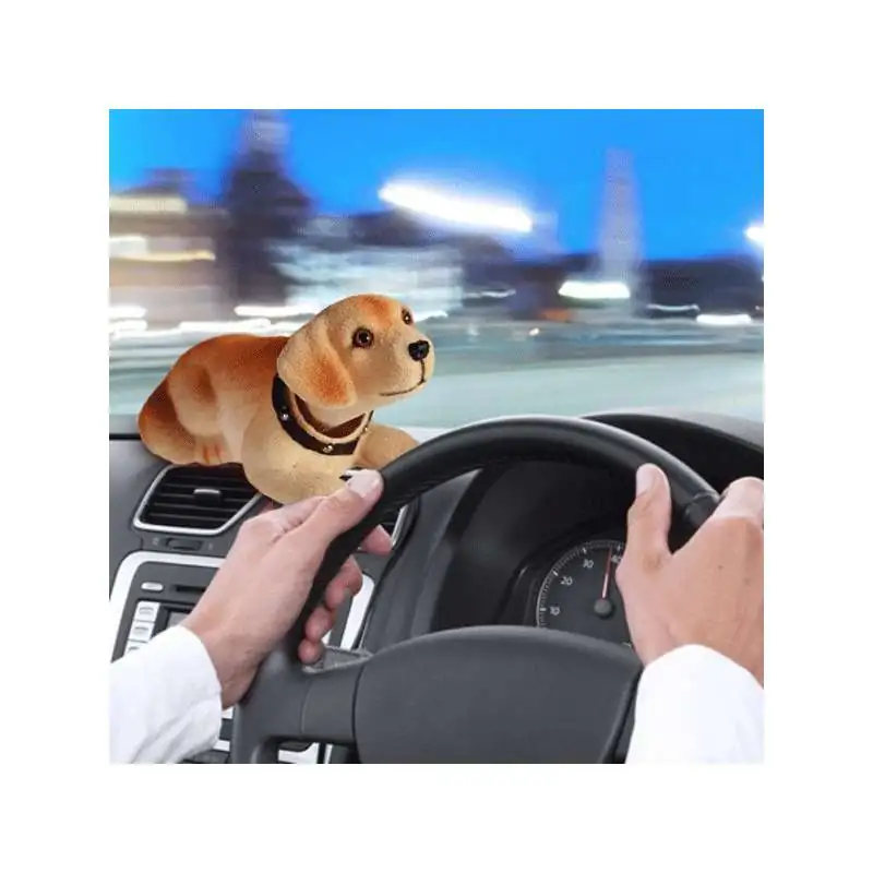 Chien qui bougeait la tete avec le mouvement de la voiture